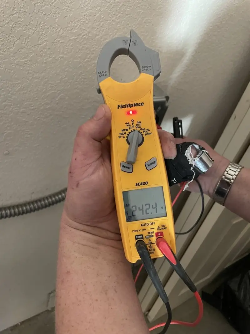 Voltage testing with clamp meter during Electrical Installation Services in Bryans Road